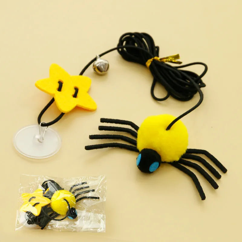 Hanging door cat toy with elastic rope, feather, bell, and spider attachment in red colour