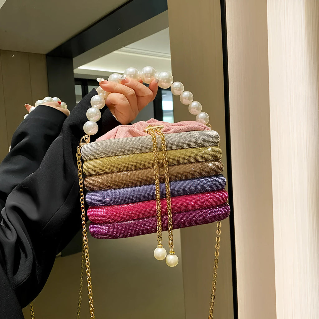 Retro style women's crossbody handbag with pearl beads in soft PU leather, shown in round shape.