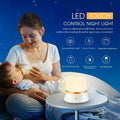 White touch-control bedside night light with motion sensor on a wooden table.