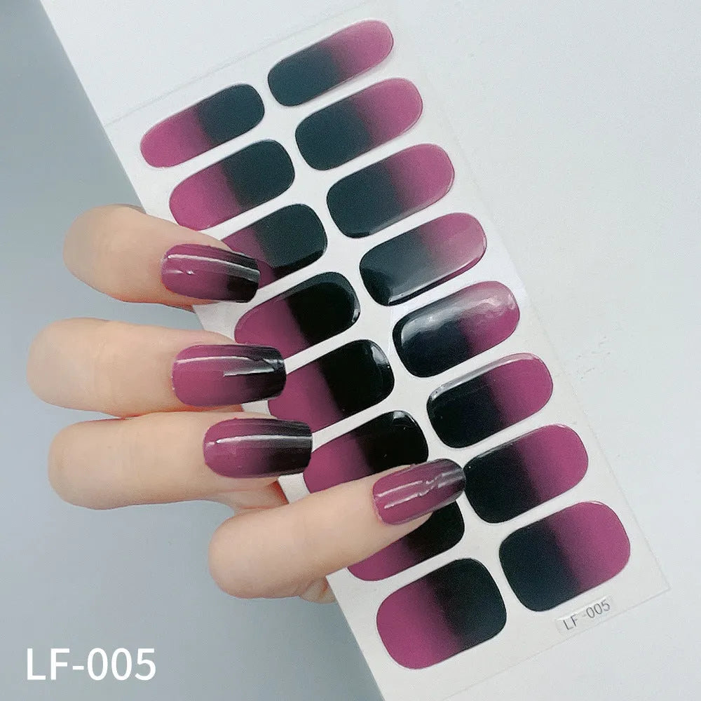 Set of 16 solid colour full nail art stickers showing patterns like cross, rose, tulip, and cartoon designs.