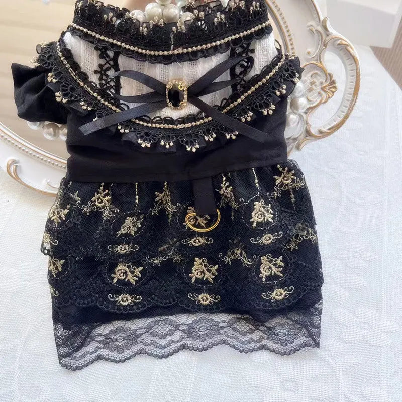 Golden polyester gothic princess style dress for a small dog on a mannequin.