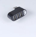 Black and white USB splitter hub showing multiple USB ports for computer connectivity