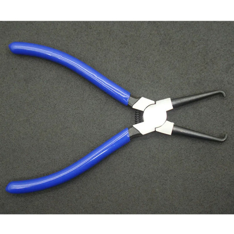 Iron caliper tubing pliers with rubber-coated handles and specialised jaws for fuel line connectors.