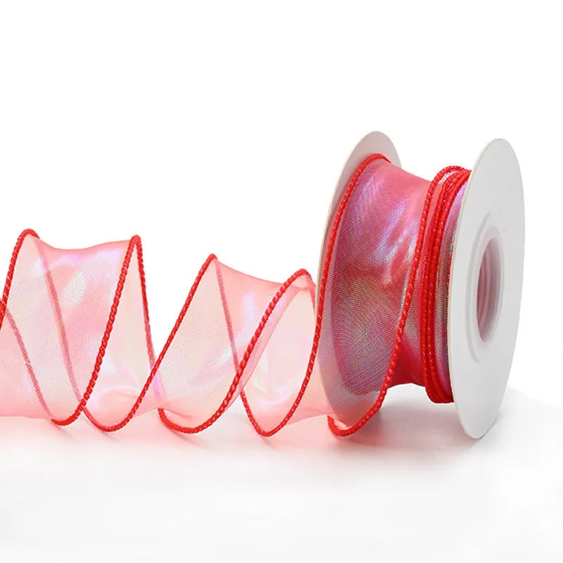 Fishtail yarn wave ribbon in various illusion colours showing 4cm width and textured mesh construction