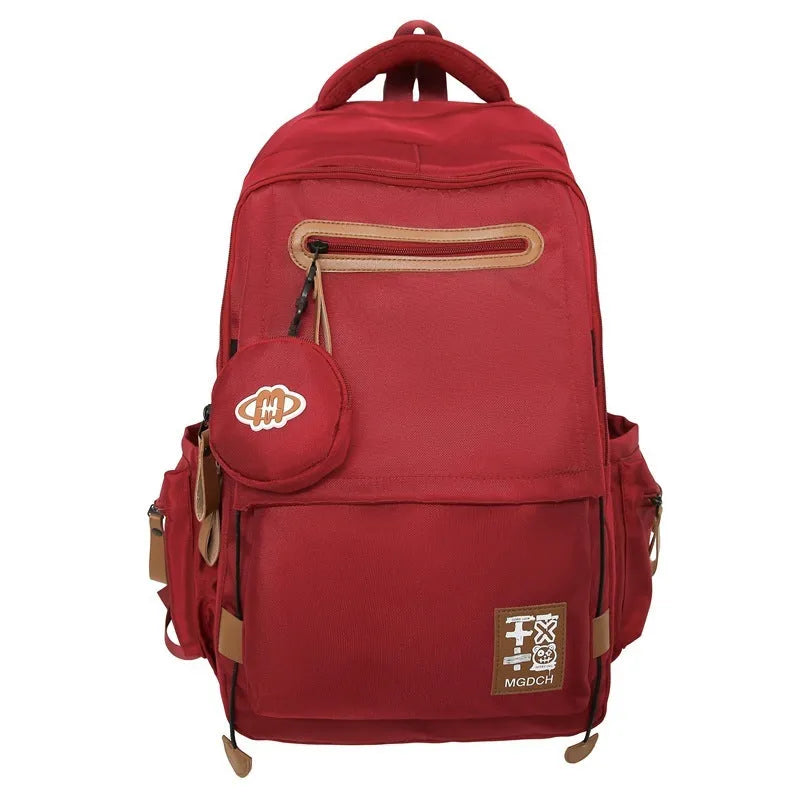 Large capacity nylon backpack for middle school students with curved shoulder straps in multiple colour options