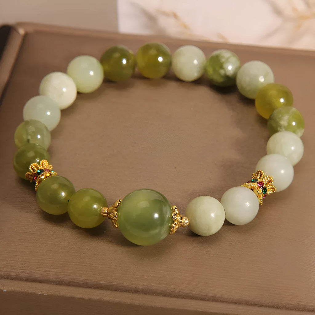 Women's green Xiuyan jade bracelet with an original sweet Mori style design.