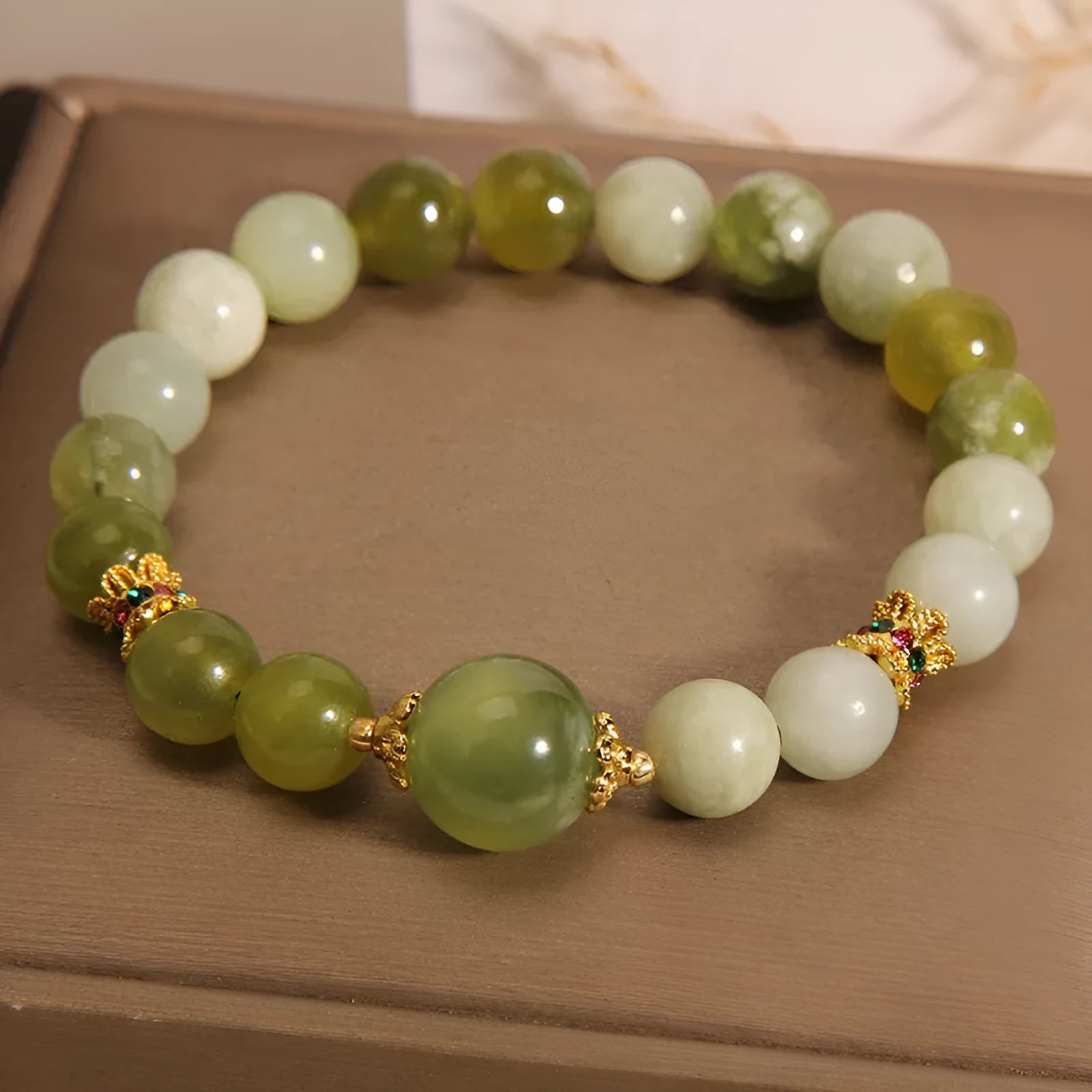 Women's green Xiuyan jade bracelet with an original sweet Mori style design.
