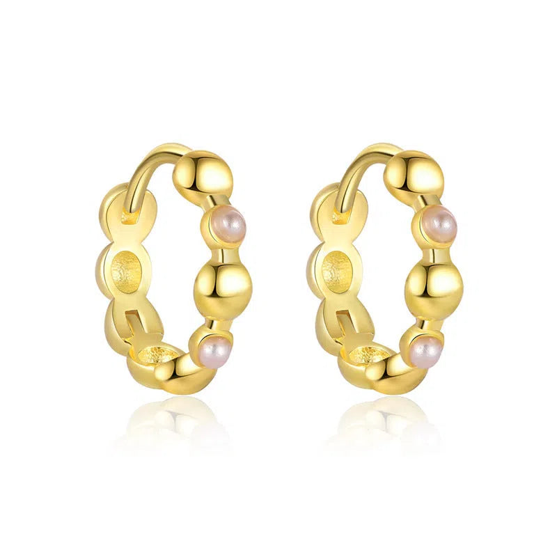 S925 sterling silver geometric earrings with yellow gold finish and inlaid zircon stone on white background