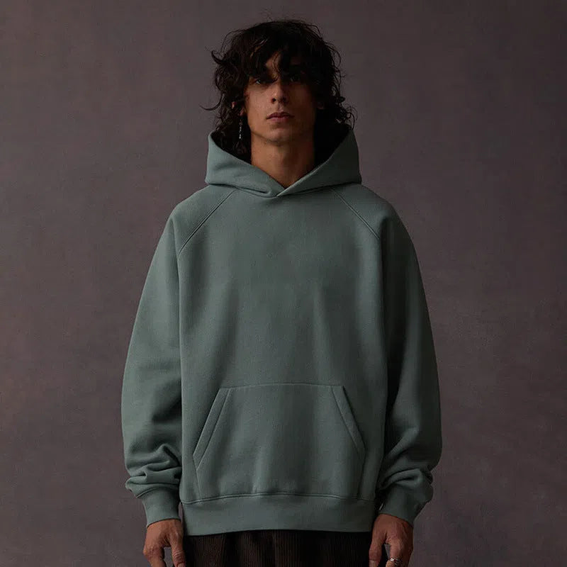 American Vintage heavyweight loose fit cotton hoodie with raglan sleeves and 3D patch pocket in 1977 Black Iron