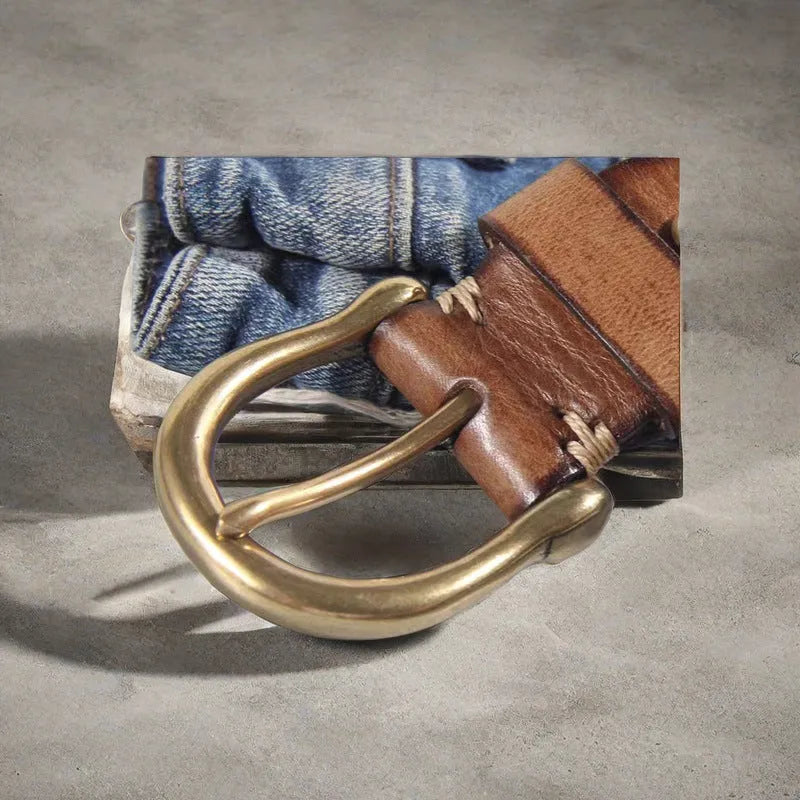 Men's black genuine cowhide casual belt with copper pin buckle on a jeans background