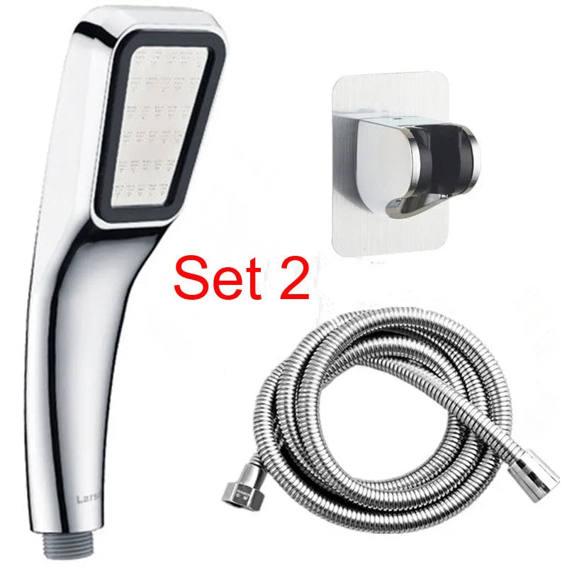 Orange hand-held rain shower set with wall bracket and connection hose