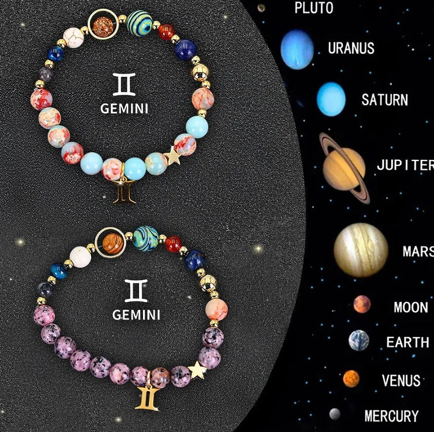 Set of two natural stone beaded bracelets showing zodiac sign designs on elasticated cords