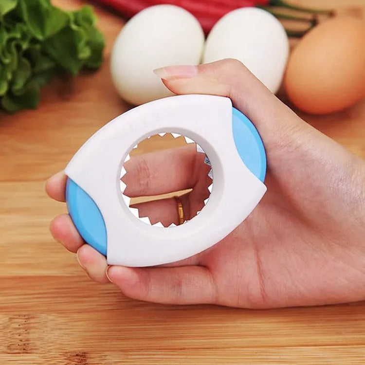 Kitchen egg topper gadget in blue with stainless steel cutting edge on suction card packaging