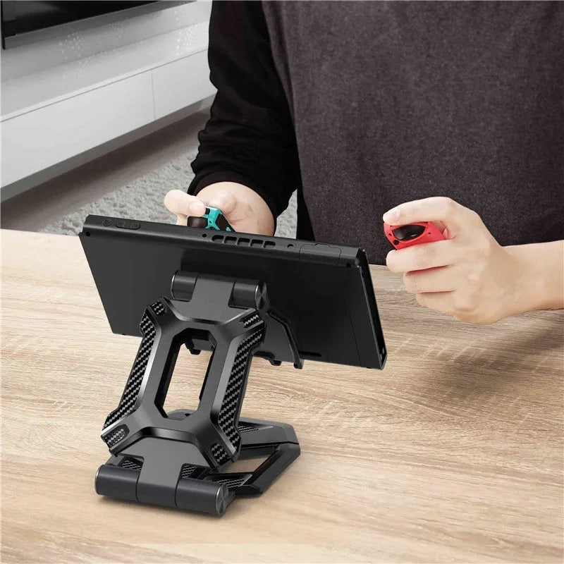 Black adjustable tablet stand folded open displaying an iPad, featuring aluminium body and 270-degree rotation
