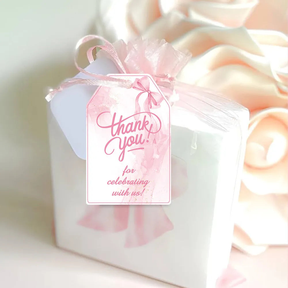 Set of 60 paper birthday gift tags with natural hemp rope in three bowknot designs.