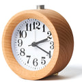 Solid beech wood silent snooze alarm clock with a 4-inch white dial on a wooden base.