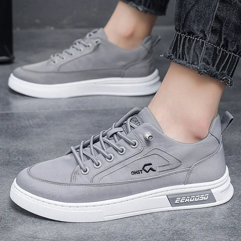 Grey men's canvas casual shoes with leather lining and rubber sole showing stitching details