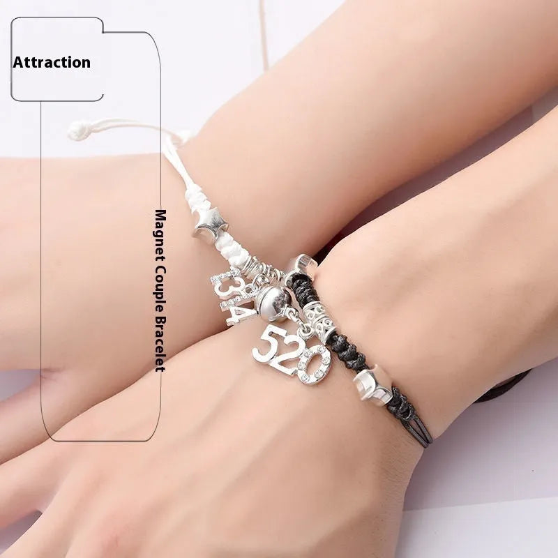 Pair of magnetic suction bracelets with alloy charms in various love and friendship themed designs on a wrist.