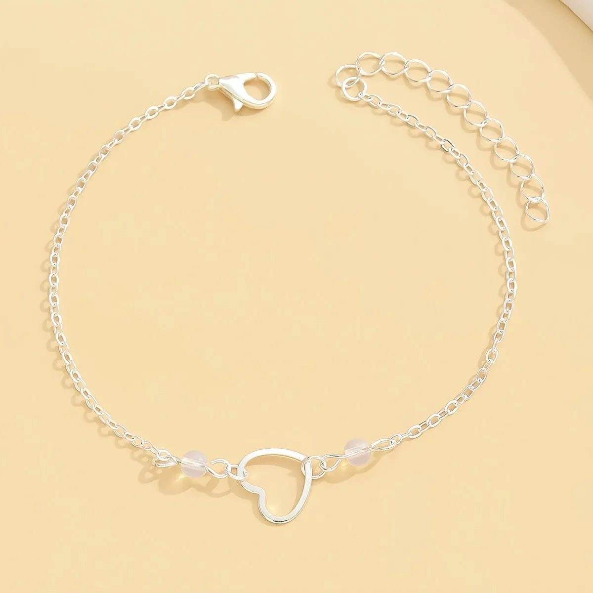 Women's anklet with heart-shaped pendant on adjustable alloy chain