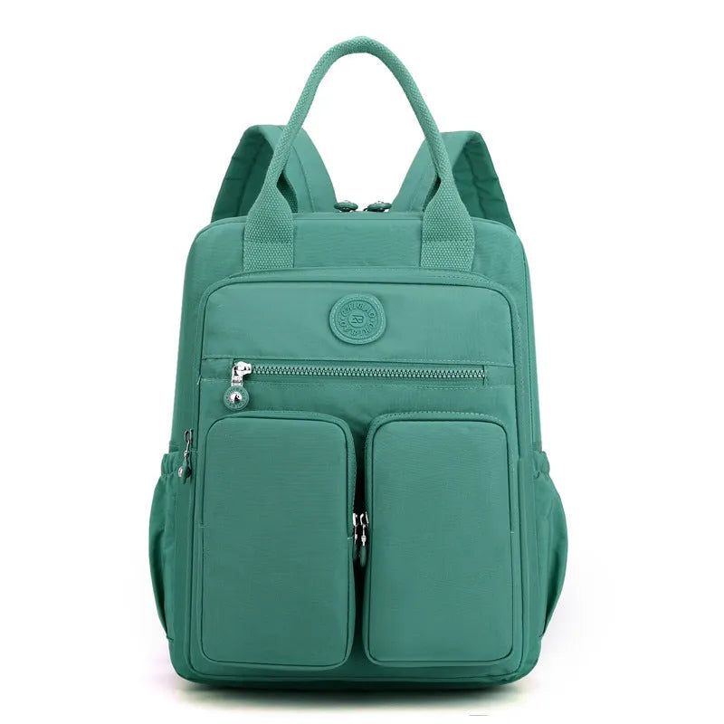 Women's waterproof nylon travel backpack with multiple internal compartments in various colours