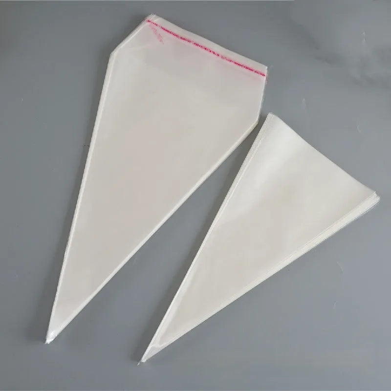 Transparent triangular plastic bag with a red wire tie closure.