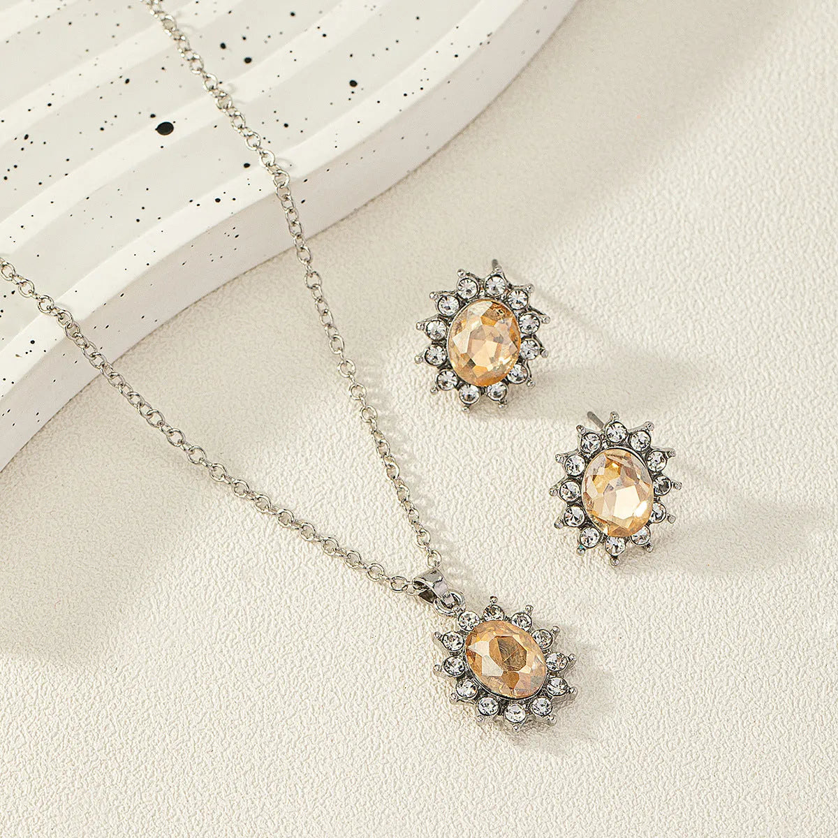 Women's alloy sunflower zircon earring and necklace set in six colour options.