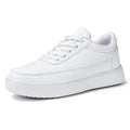 Women's white leather lace-up casual flat shoes on a solid background.