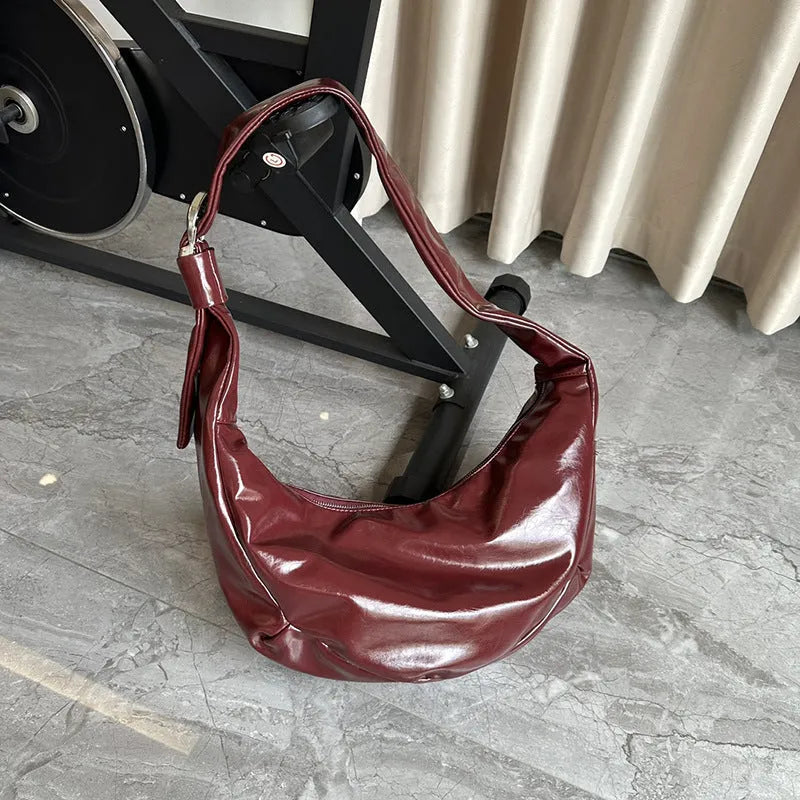 Soft PU large capacity commuter shoulder bag in black, horizontal square shape, with single shoulder strap
