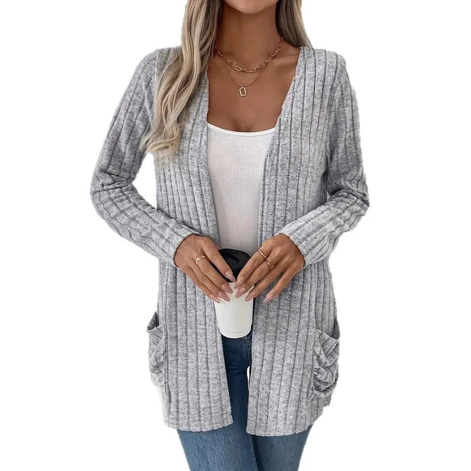 Women's solid colour long sleeve cardigan with pockets in loose fit, shown in Granny Grey.
