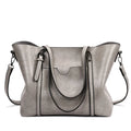 Retro style women's messenger bag in PU leather, shown in light blue colour