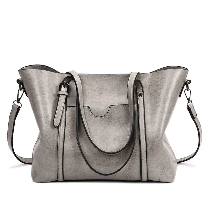 Retro style women's messenger bag in PU leather, shown in light blue colour
