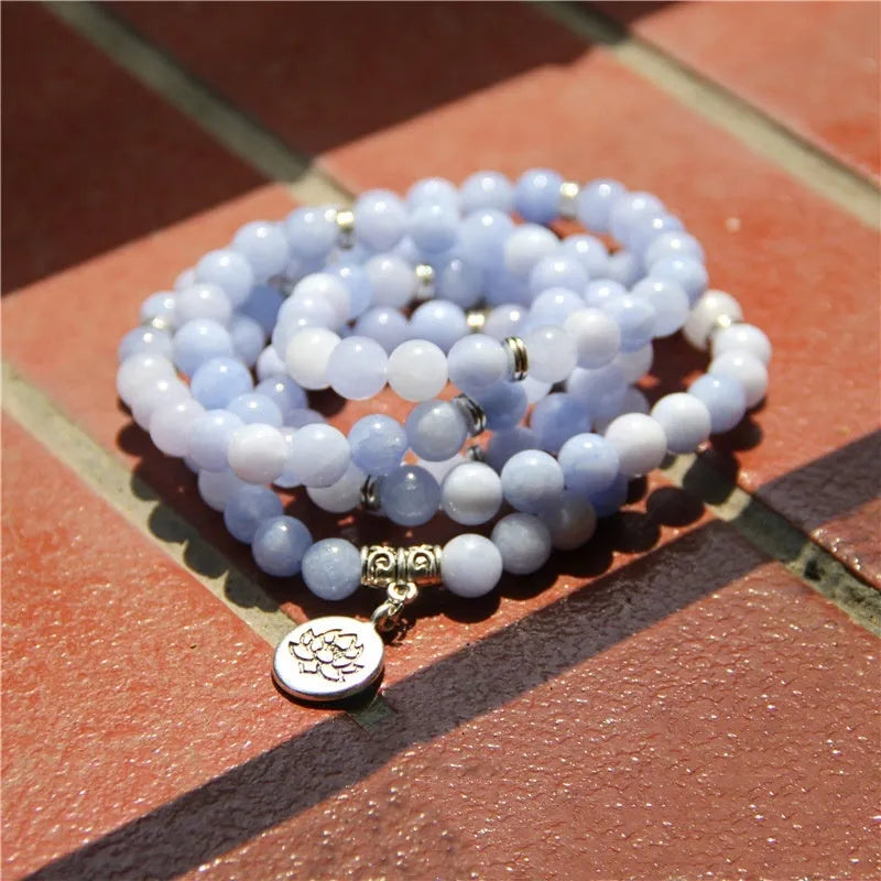 Women's bracelet with natural stone lotus pendant in geometric design showing eight colour variations