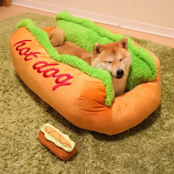 Grey hot dog style pet bed with high sides, a removable centre mat, and an anti-slip fabric base.