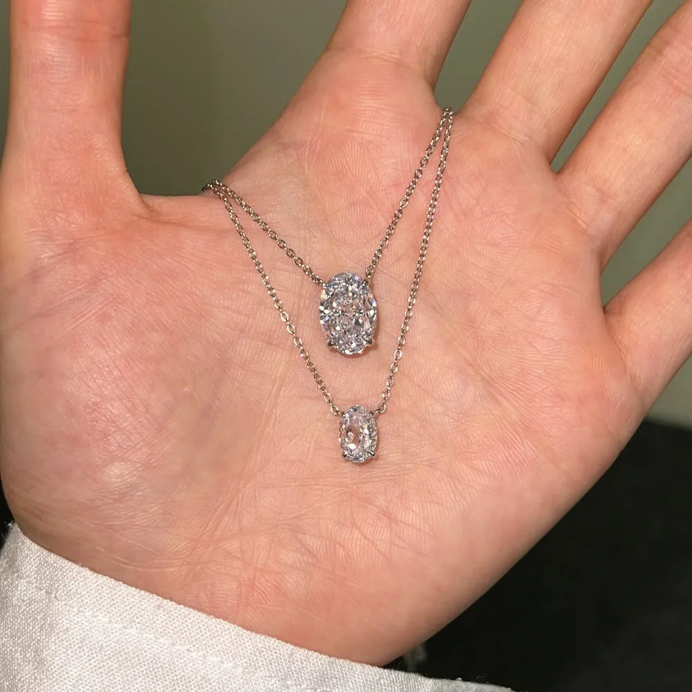Women's S925 sterling silver necklace with a geometric oval ice flower pendant in gold or platinum finish.