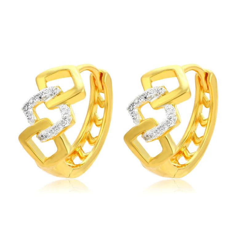 A pair of gold geometric earrings with a hollow out design and clip-on fastening.