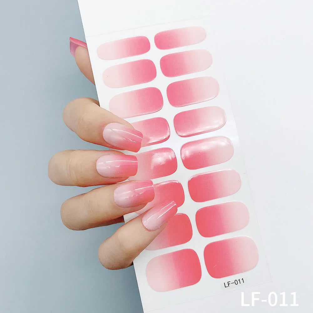 Set of 16 solid colour full nail art stickers showing patterns like cross, rose, tulip, and cartoon designs.