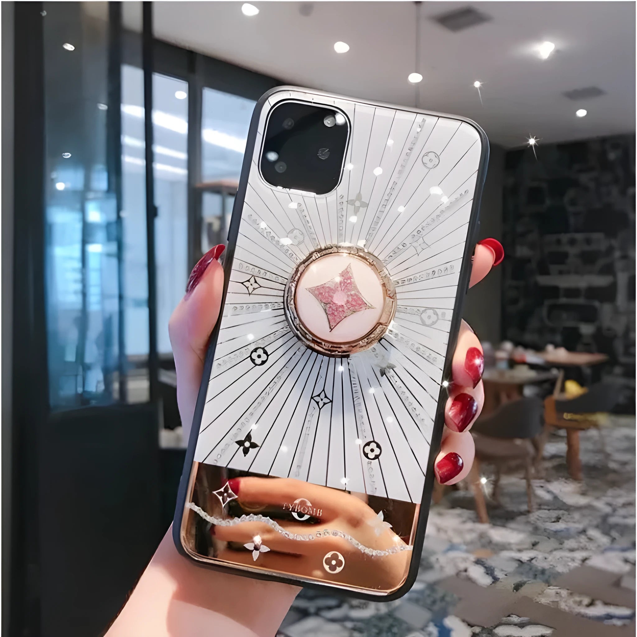 Luxury diamond and gold ring holder stand holding an iPhone for hands-free viewing.