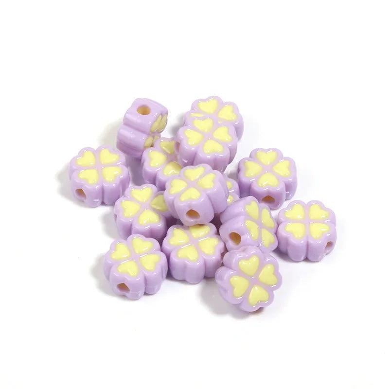 Assortment of 15mm frosted acrylic four-leaf clover beads in rose red, pink, yellow, green, blue, and purple colours.