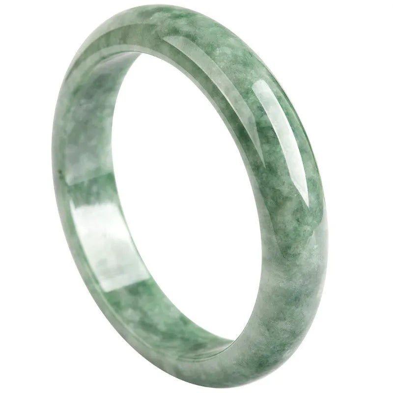 A simple deep pea green women's bracelet shown with a gift box and certificate.
