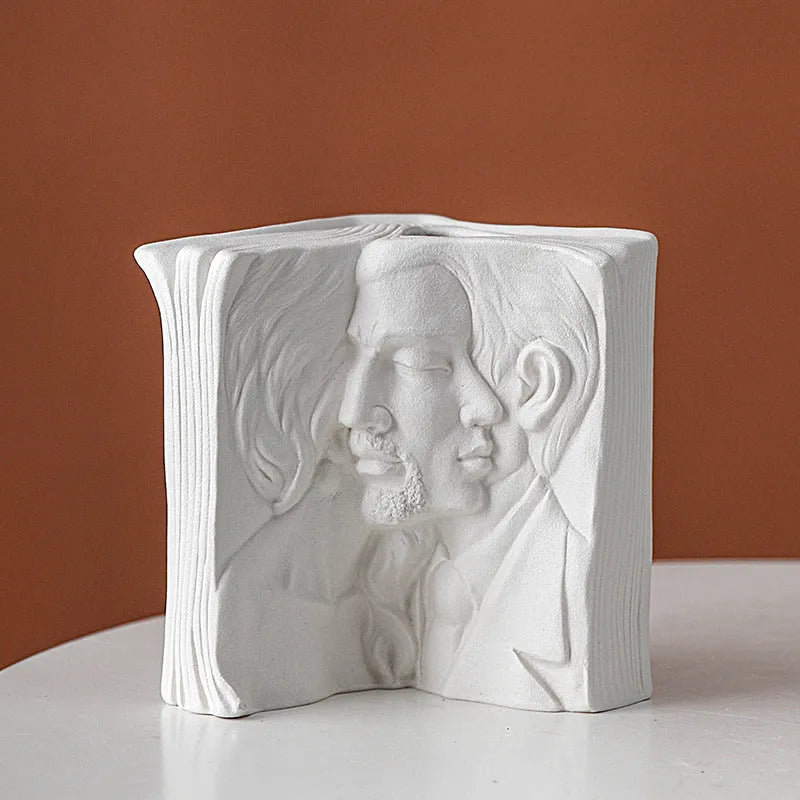 Glazed ceramic book stand in one of four artistic styles: lover, dancer, beauty and beast, or brushed face.