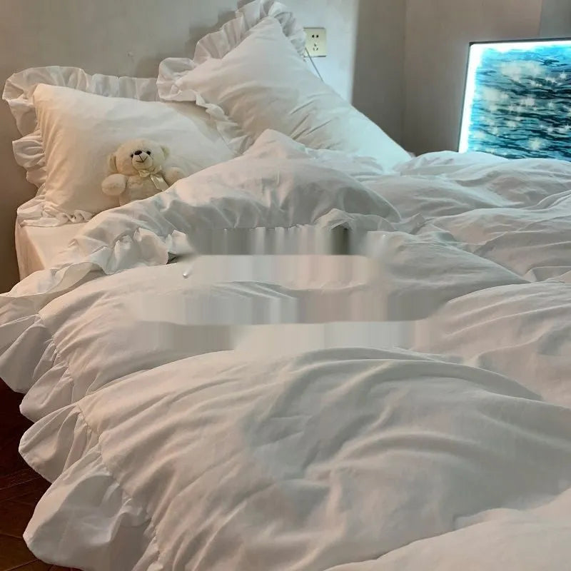 Solid colour washed linen quilt cover and pillowcases from a mori style four-piece bedding set.