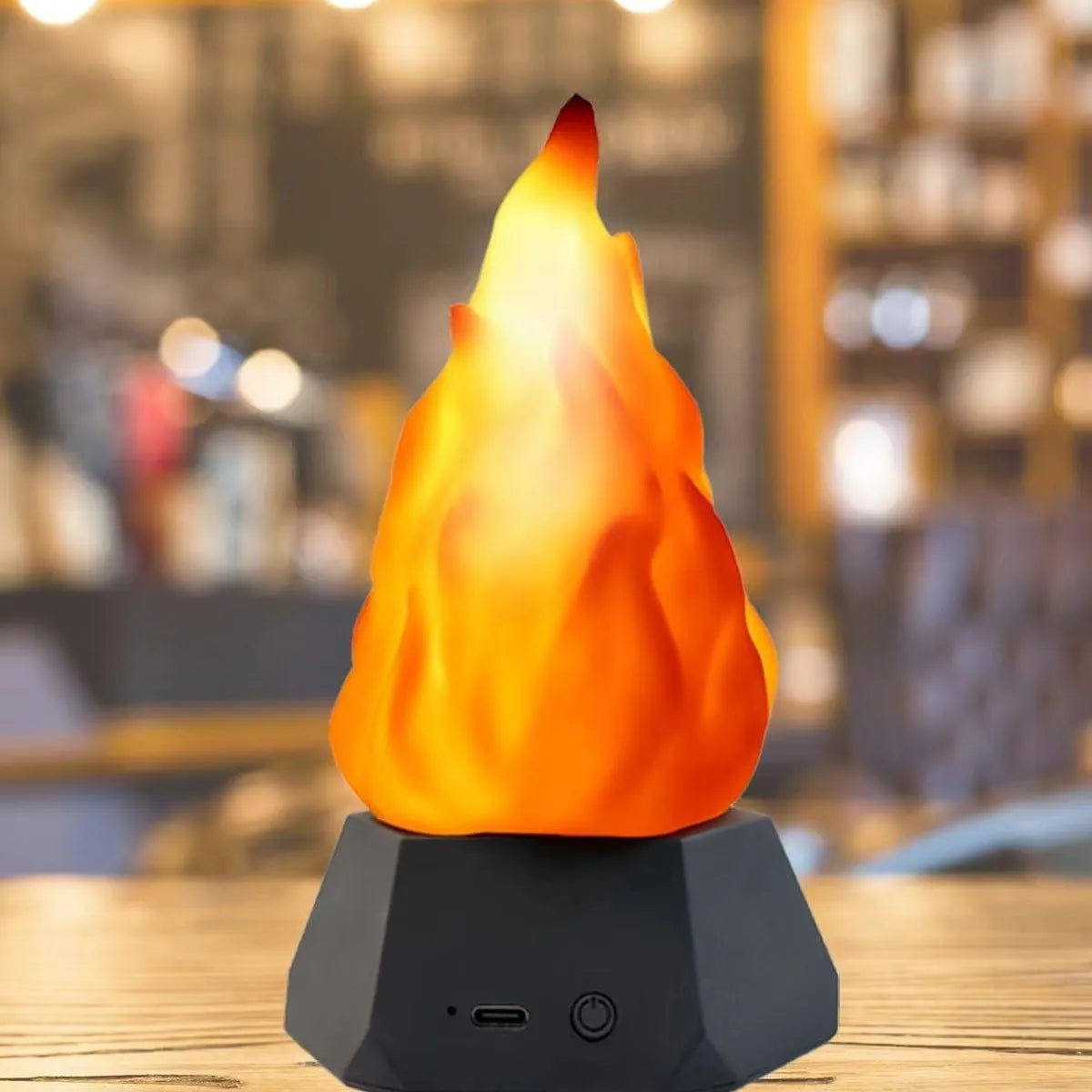 Solar-powered flame-shaped decorative light with charging base for outdoor camping and courtyard illumination