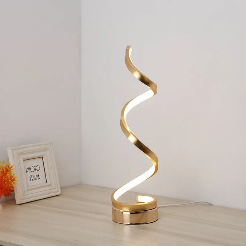 Minimalist black LED table lamp with aluminium shade and tri-colour dimming on wooden bedside table
