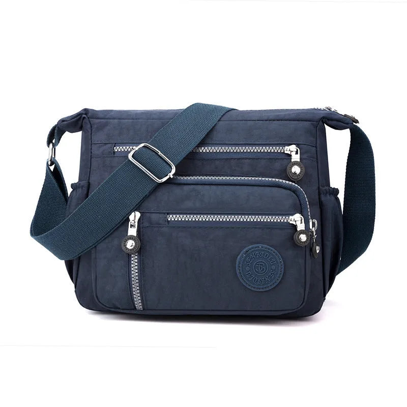 Soft nylon large capacity square messenger bag in multiple colour options on a single shoulder strap.