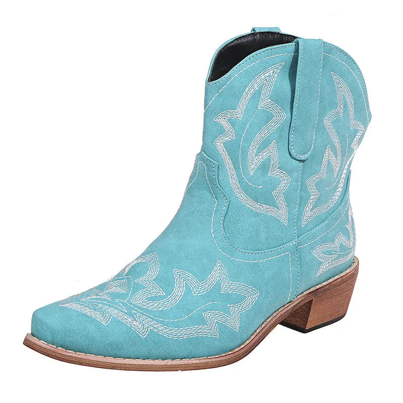 Blue women's cowboy boots with embroidery on the shaft and a low wedge heel.