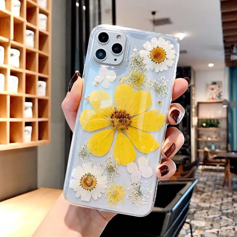 Pink and yellow floral pattern TPU back cover case for iPhone on a white background.