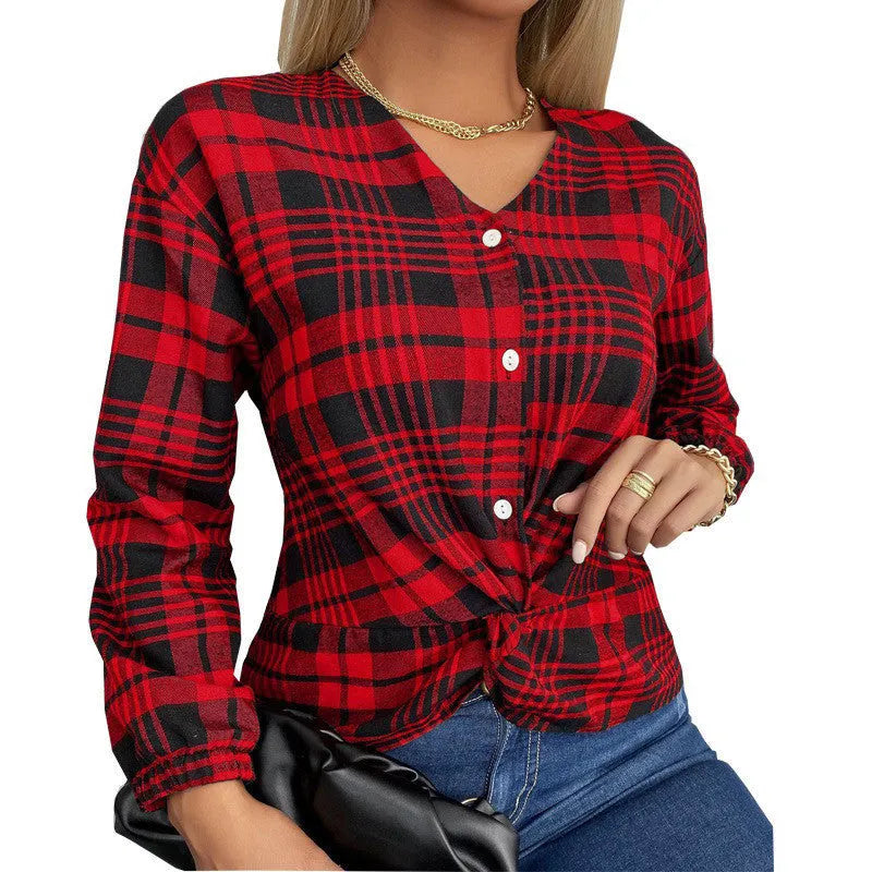 Woman wearing a loose-fit purple plaid casual shirt with regular sleeves.
