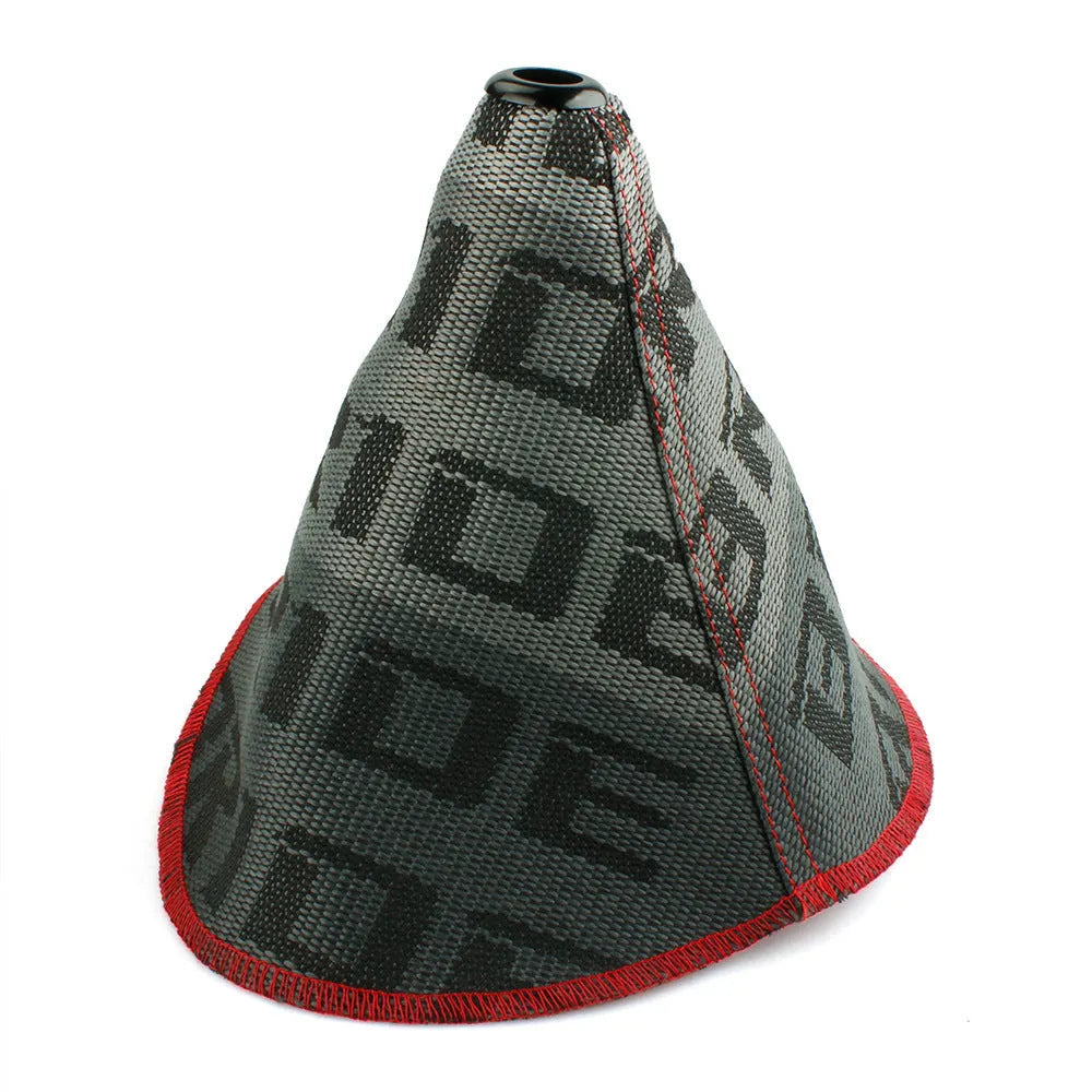 Canvas dust cover draped over a racing bucket seat in a vehicle interior.