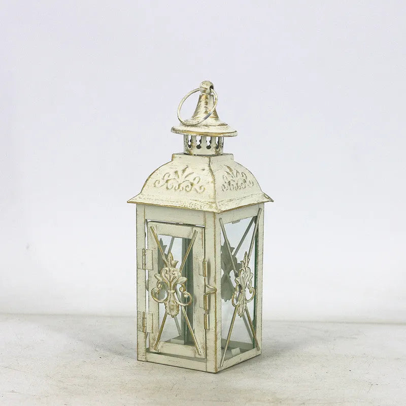 Black and white gold wrought iron storm lantern with tempered glass in three sizes for courtyard decoration.