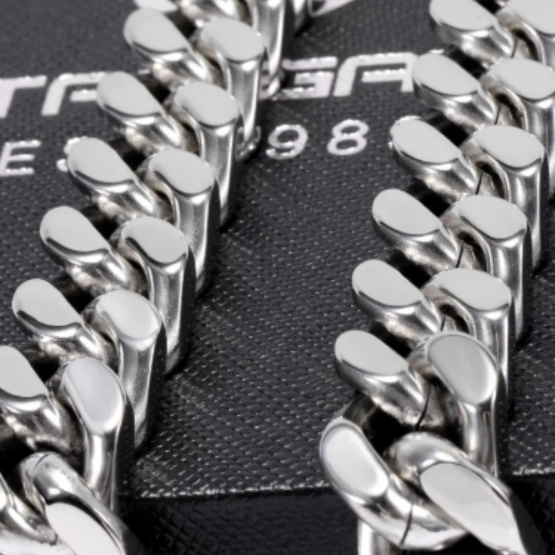Polished titanium steel Cuban link choker chain necklace in 12mm width on black background